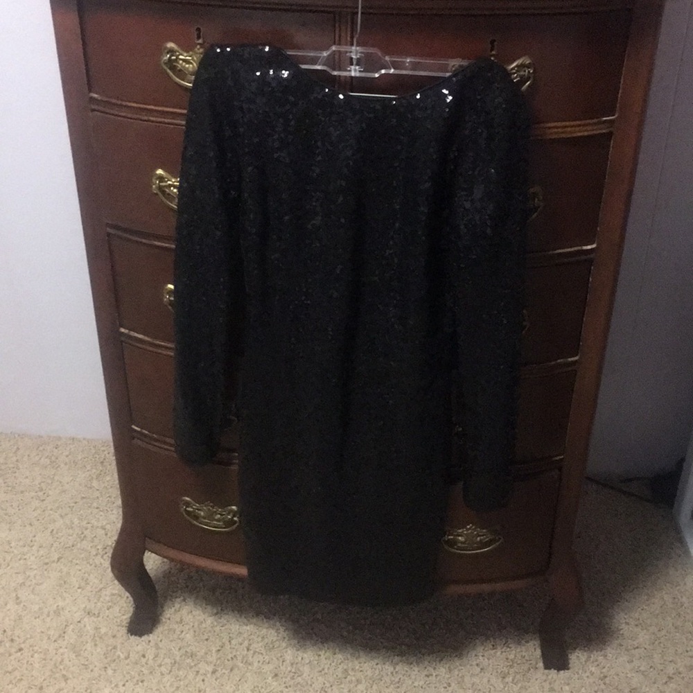 Backless long-sleeves black sequin mini dress.